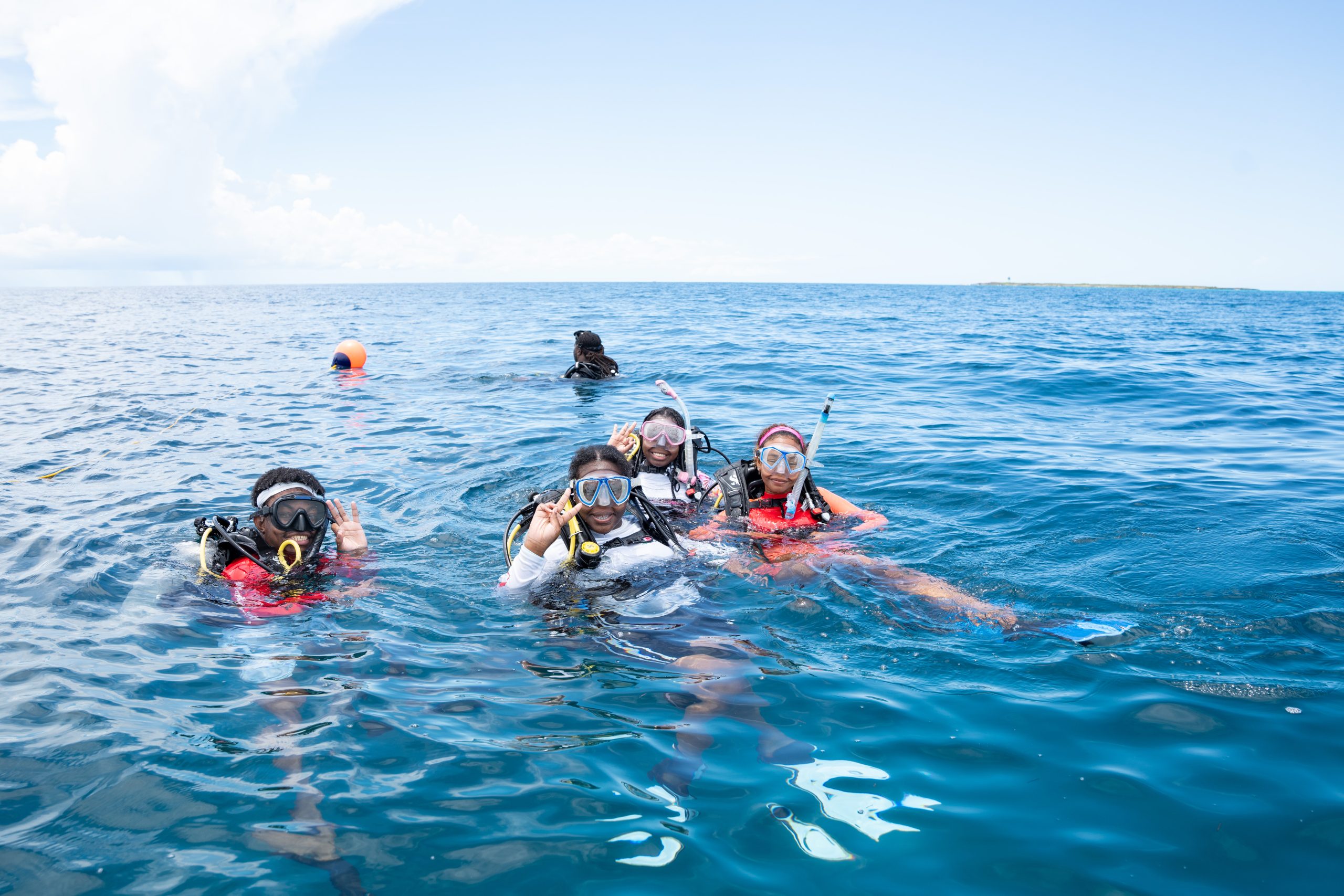 Group of trainees in the water during a coral restoration training dive in Nassau.